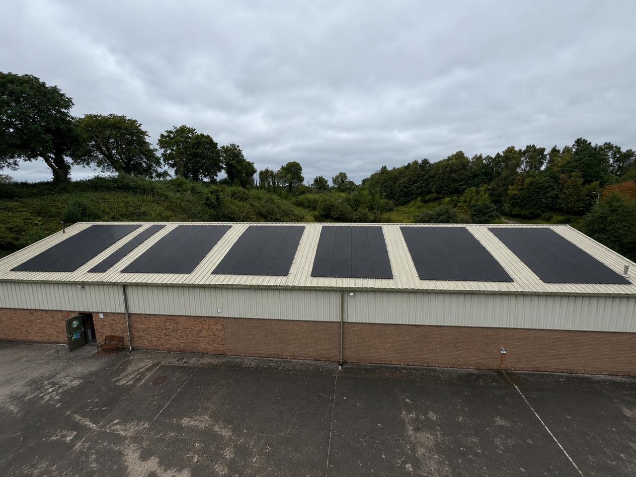 A completed rooftop solar array on a commercial building, a B9 group install