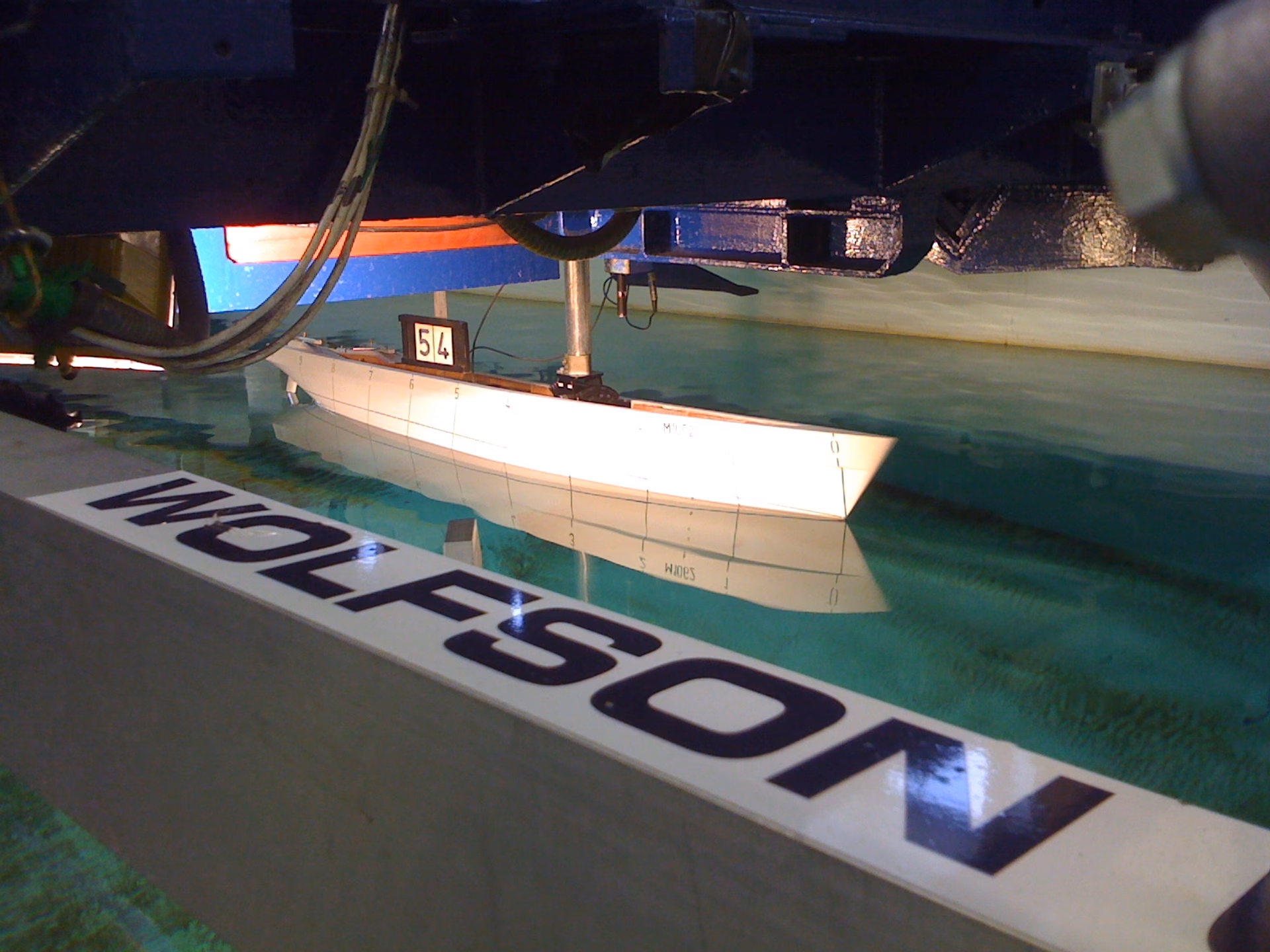 Commercial vessel scale model undergoing hydrodynamic testing at the Wolfson Unit towing tank.
